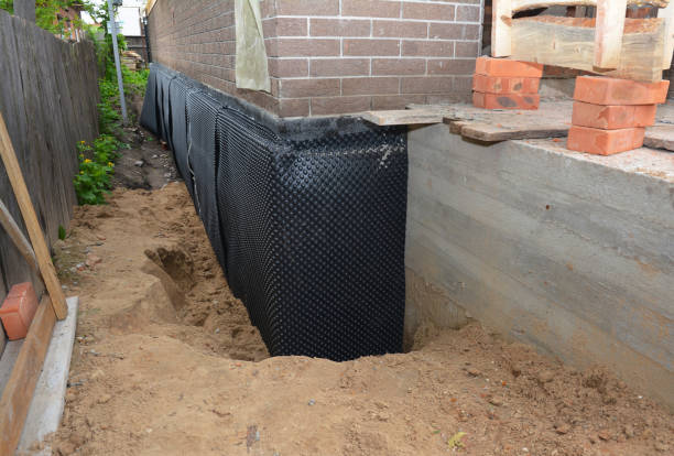 SJ Waterproofing Pros technician performing targeted Interior Drainage System assessment in Berlin, MD